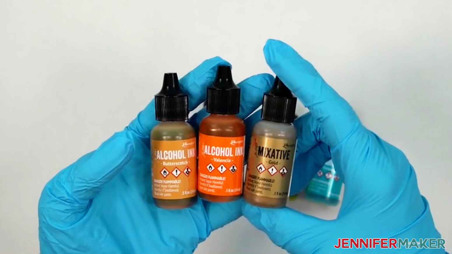 Yellow, orange, and gold alcohol inks displayed.