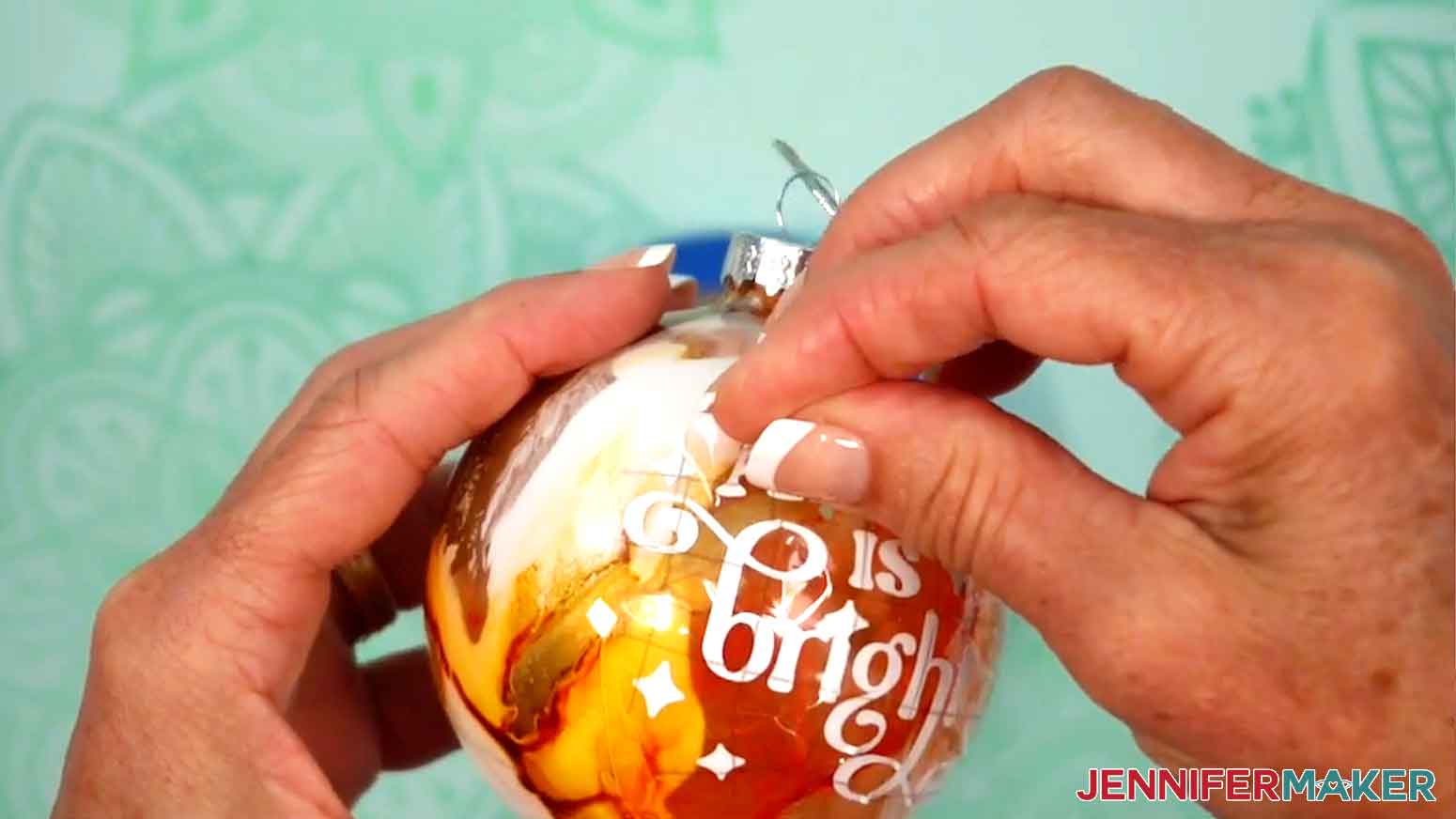 Carefully remove the transfer tape from the ornament.