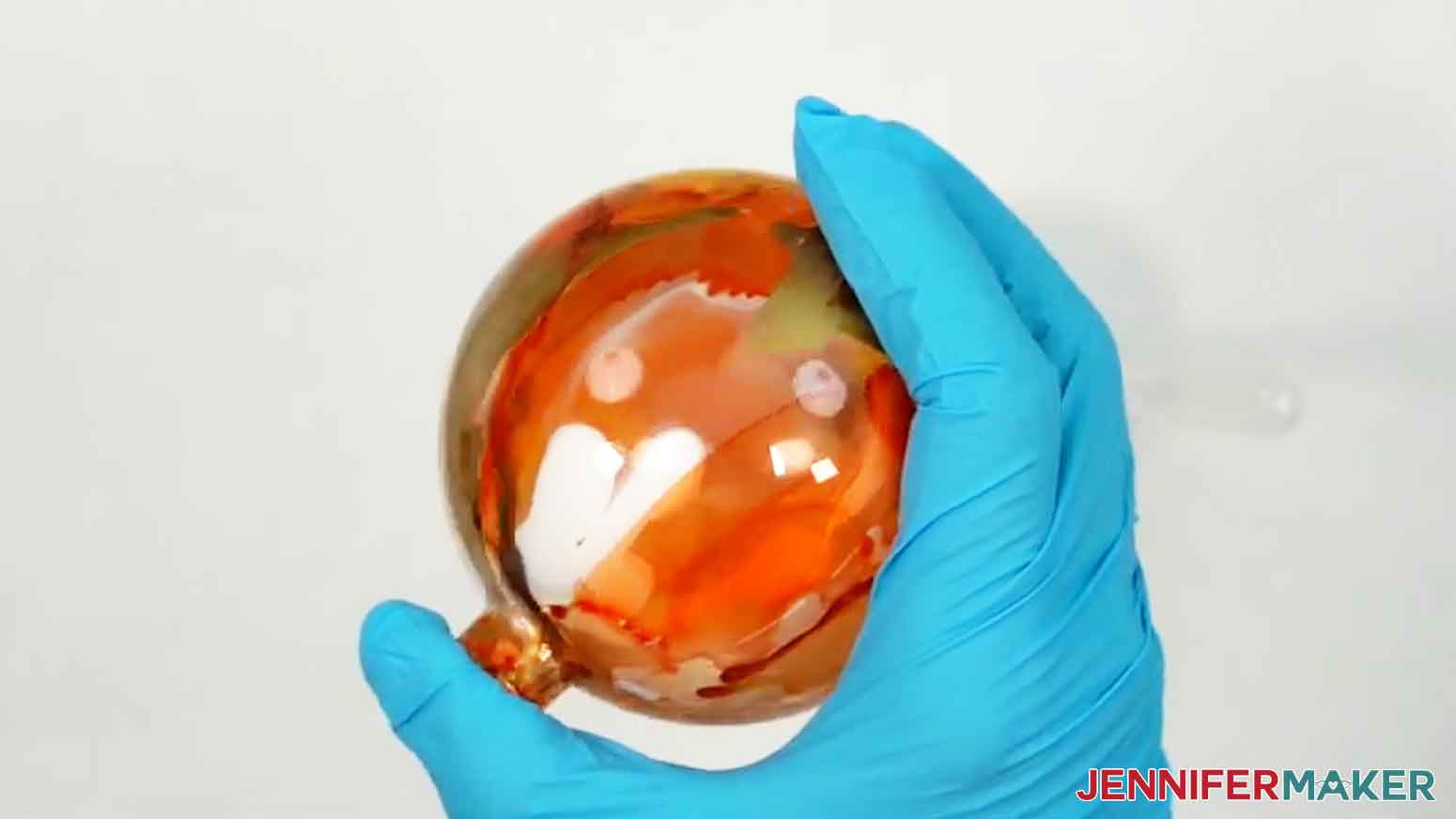 Shake the ornament vigorously in all directions to mix the water with the paint.