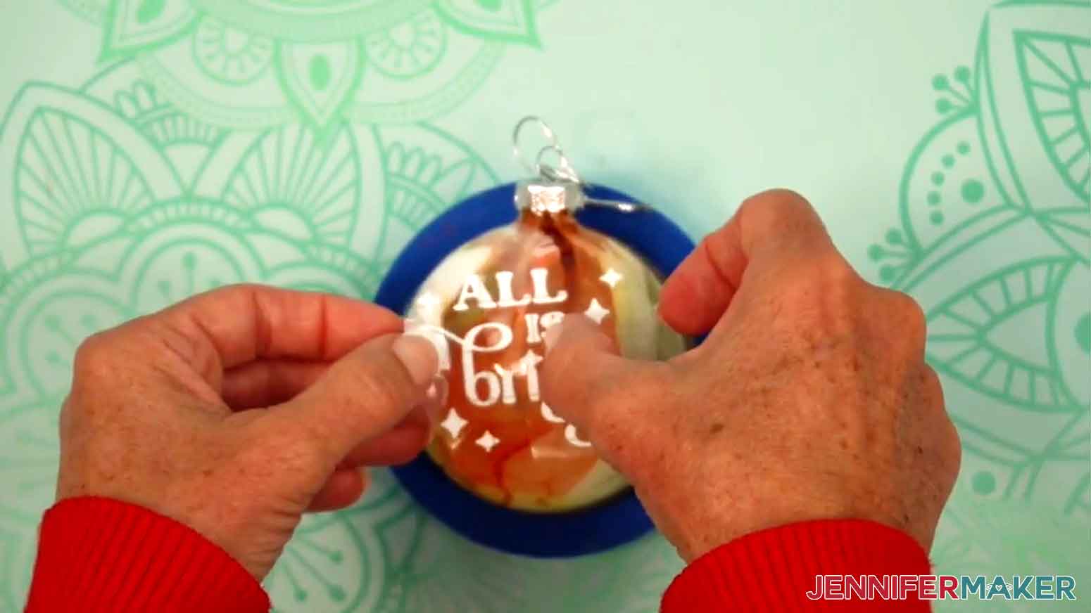Bend the design into a taco shape and touch just the middle onto the approximate center of your ornament.