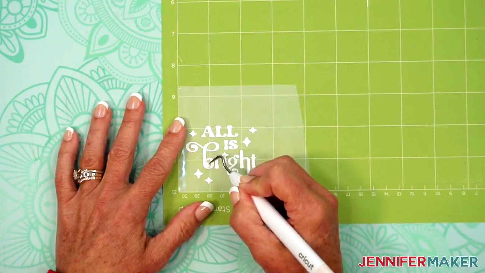 Use your weeding tool to gently lift and remove any other areas you want to remove, like the insides of the letters.
