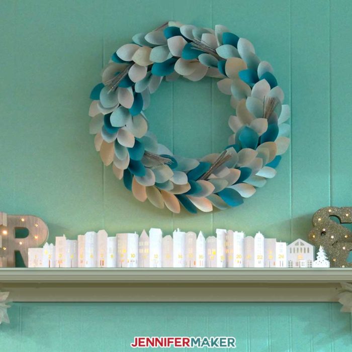 The DIY Christmas Town Countdown on my mantle for holiday decorating