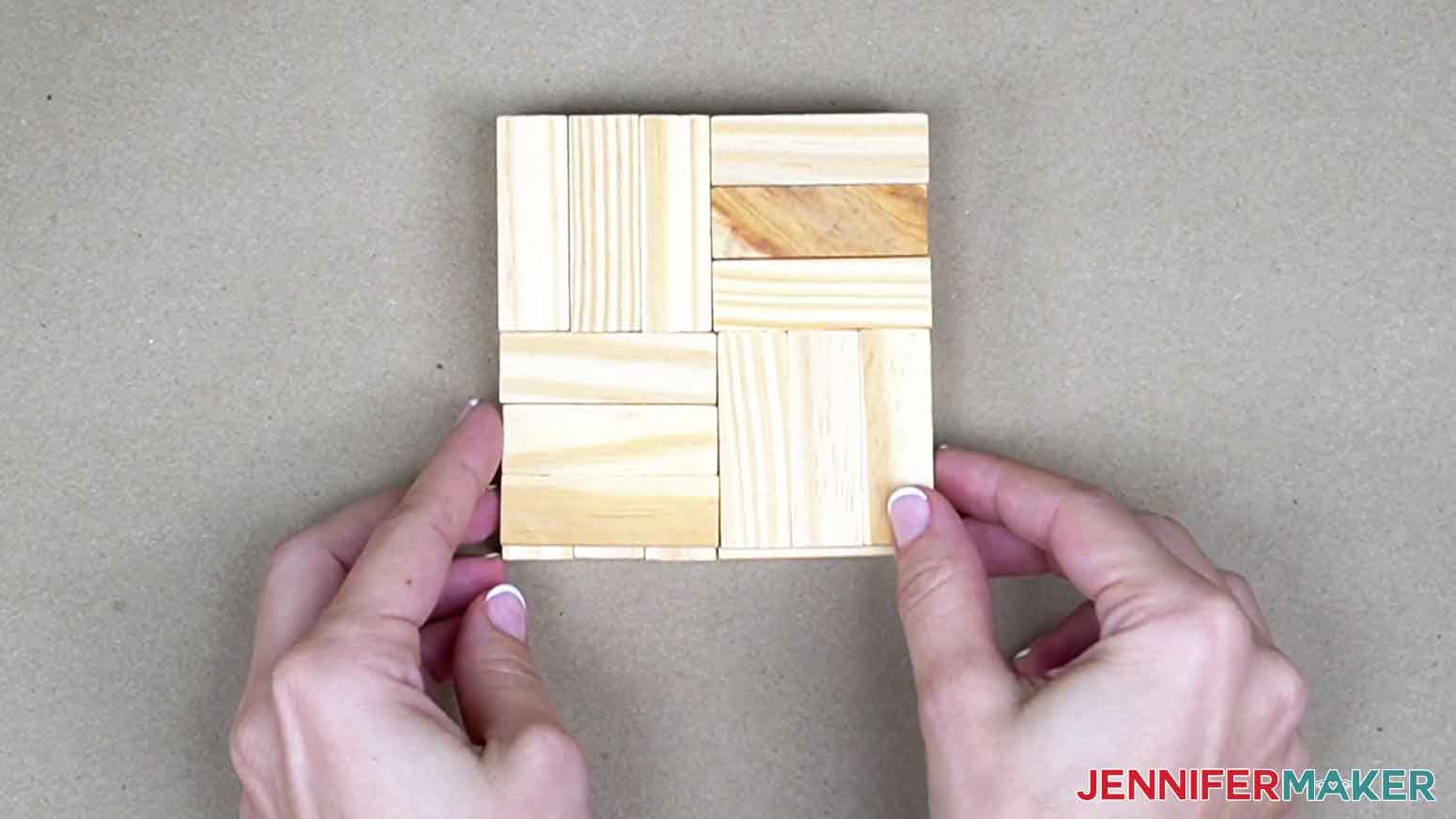 Layout wooden blocks to visualize size and shape of gift box decoration.