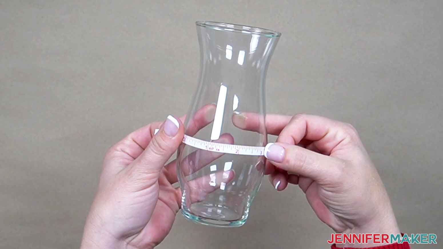 Use a tape measure to measure width of design area on glass vase.