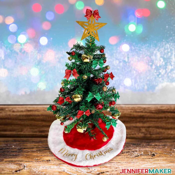 Dollar Tree Christmas Tree with bows and bells, and a custom tree skirt