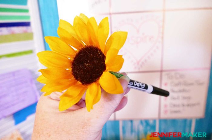 A whiteboard pen with a silk sunflower taped to it to go with my DIY Command Center