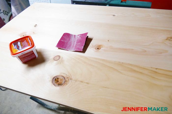 Sanding and filling the planks for the DIY Command Center with Paper Storage Shutters