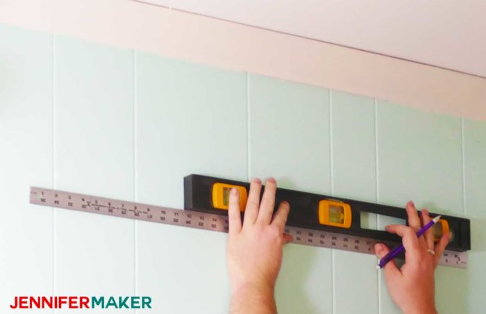 Measure and mark your wall, using a level, before installing the DIY copper pipe curtain rods