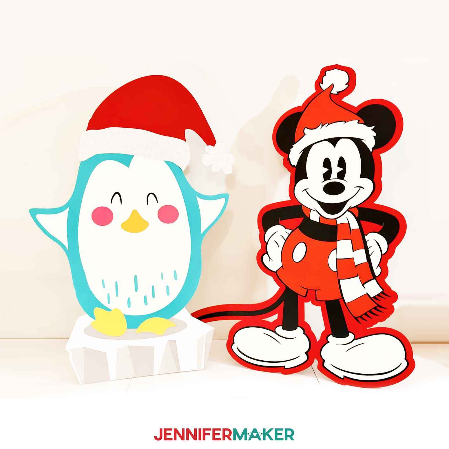 The completed Santa Mickey Mouse and Giant Penguin DIY Cut Out Characters.