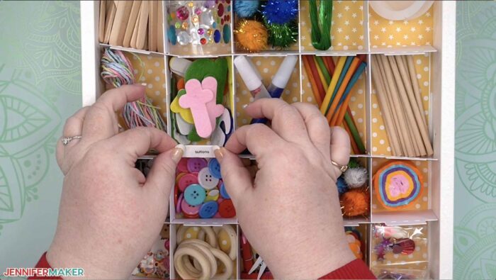 Labelling an organized drawer with DIY drawer divider strips made on a Cricut