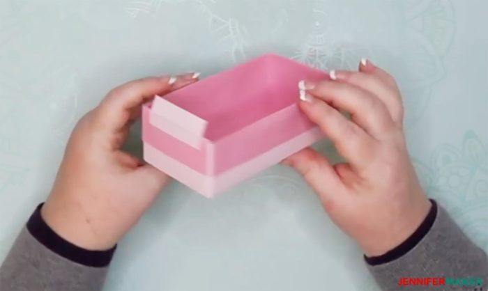 A finished DIY drawer divider box made from pink cardstock