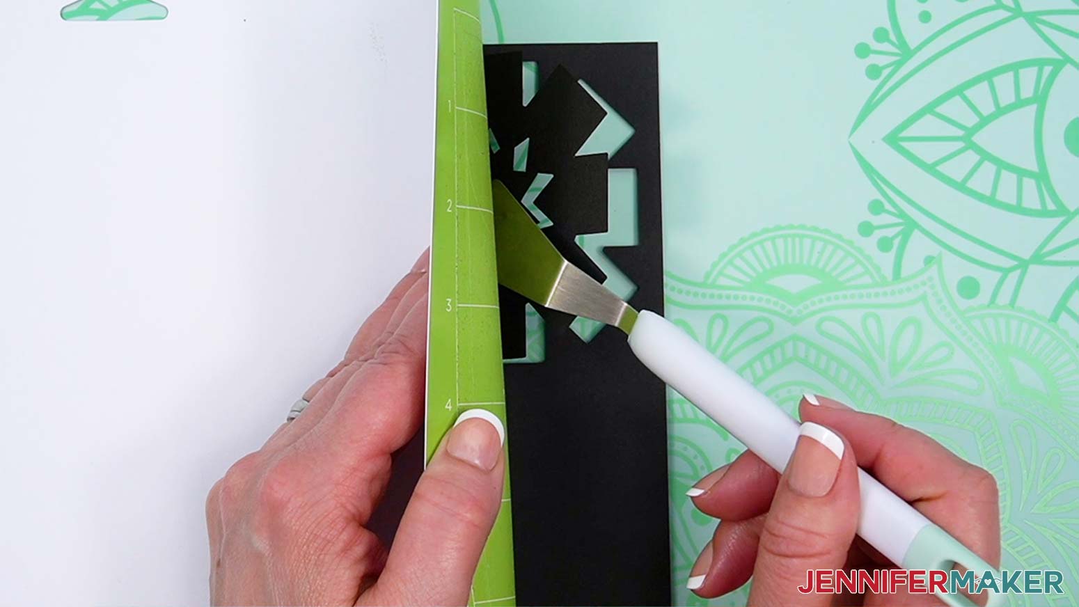 Use a spatula tool to remove small bits of cardstock from the machine mat.