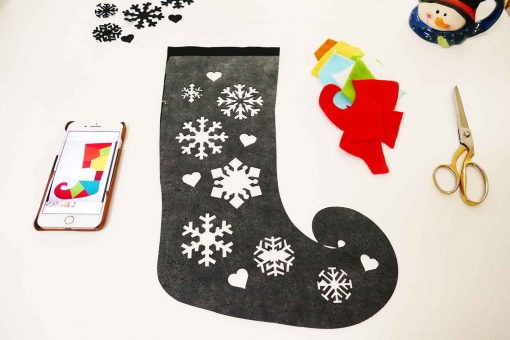 Remove the backing from the Wonder-Under that is on the back of your DIY elf stocking