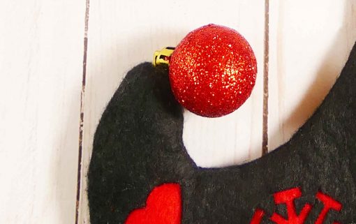 Attach the ornament to the tip of the diy elf stocking