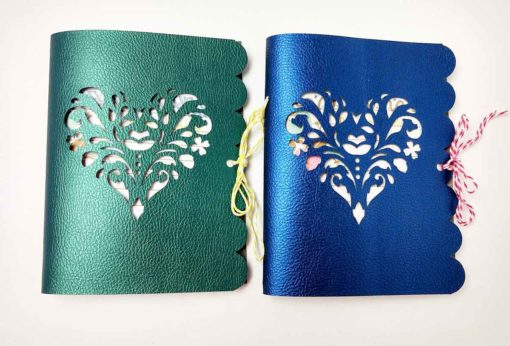 Green and blue faux leather journals designed by JenniferMaker and made by AmyGonnaCraft