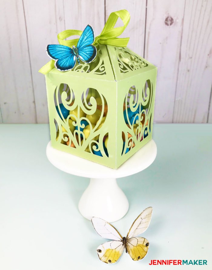 Green paper filigree diy favor box or treat box made with shimmer paper on a Cricut