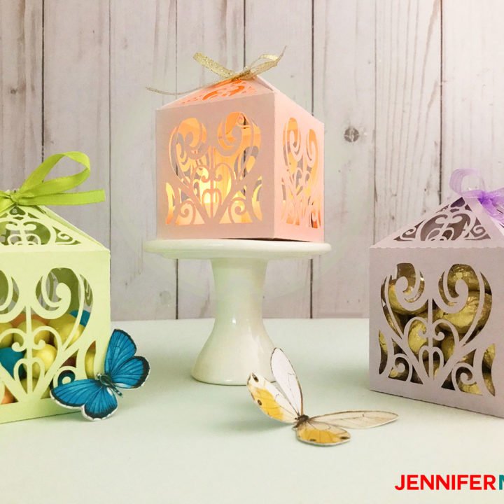Green, pink, and lavender paper filigree diy favor box or treat box made with shimmer paper on a Cricut