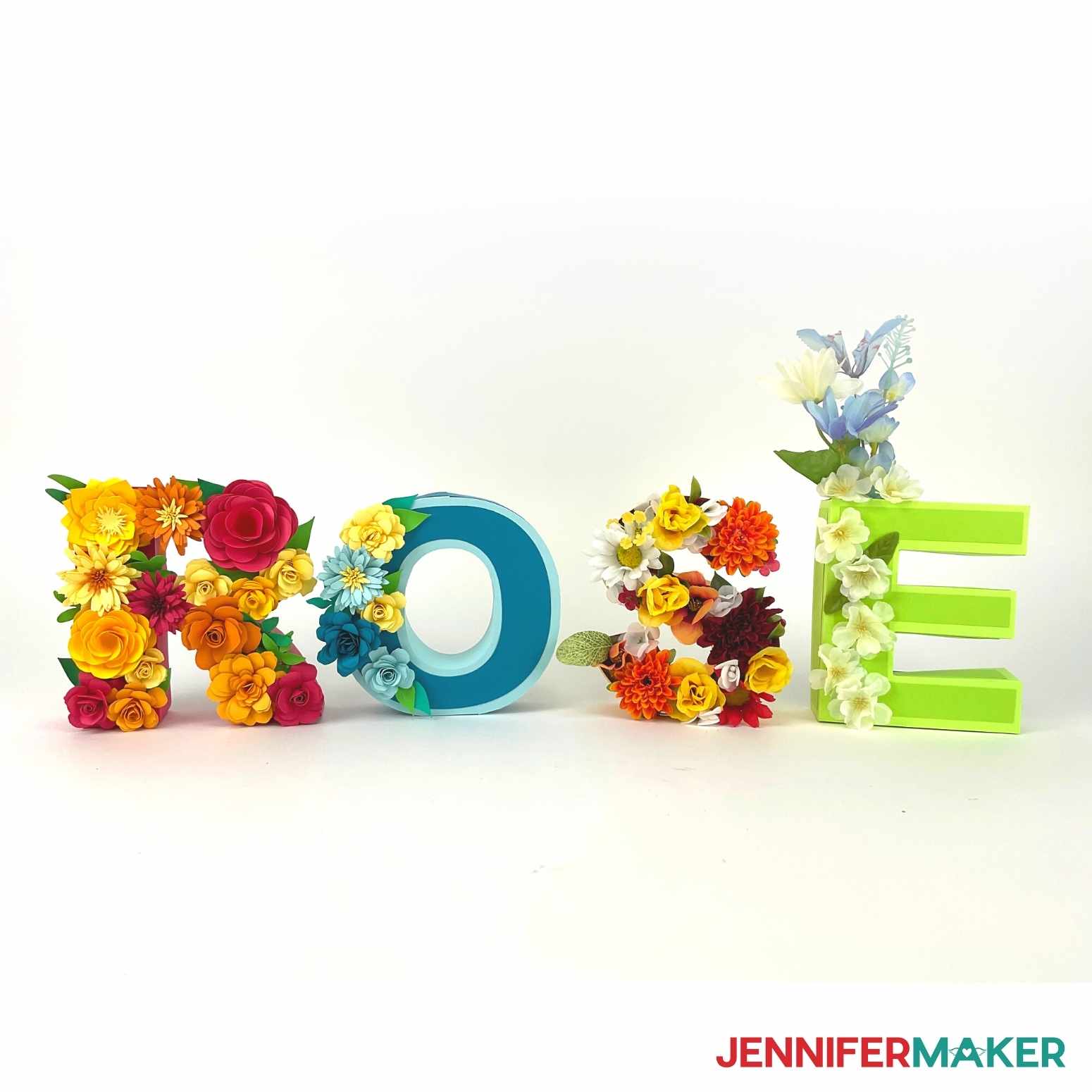 DIY Floral Letters filled with faux flowers and used as a vase.
