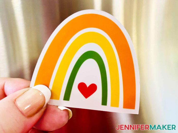 The rainbow DIY fridge magnet features orange, yellow, and green stripes over a red heart.