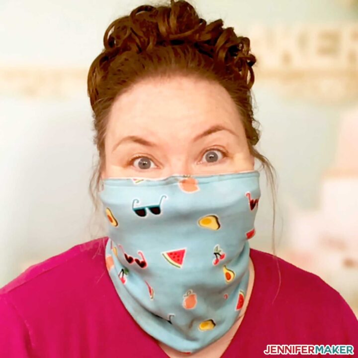 Jennifer Maker wearing a cute blue knit gaiter face mask made from her pattern
