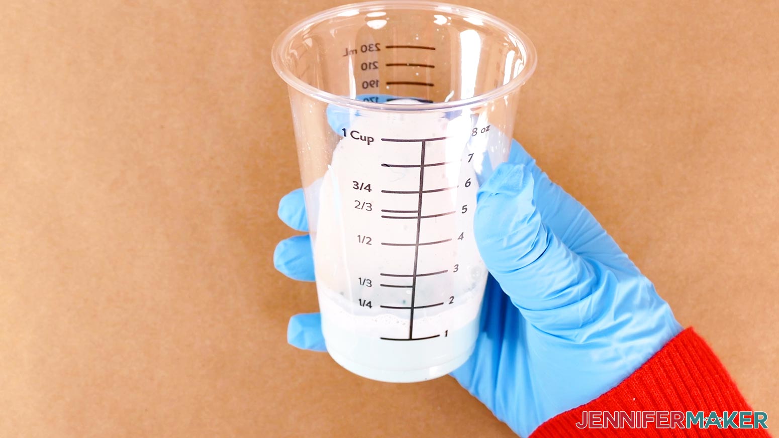 Mix the paint and textile medium in a plastic cup for the DIY board game box