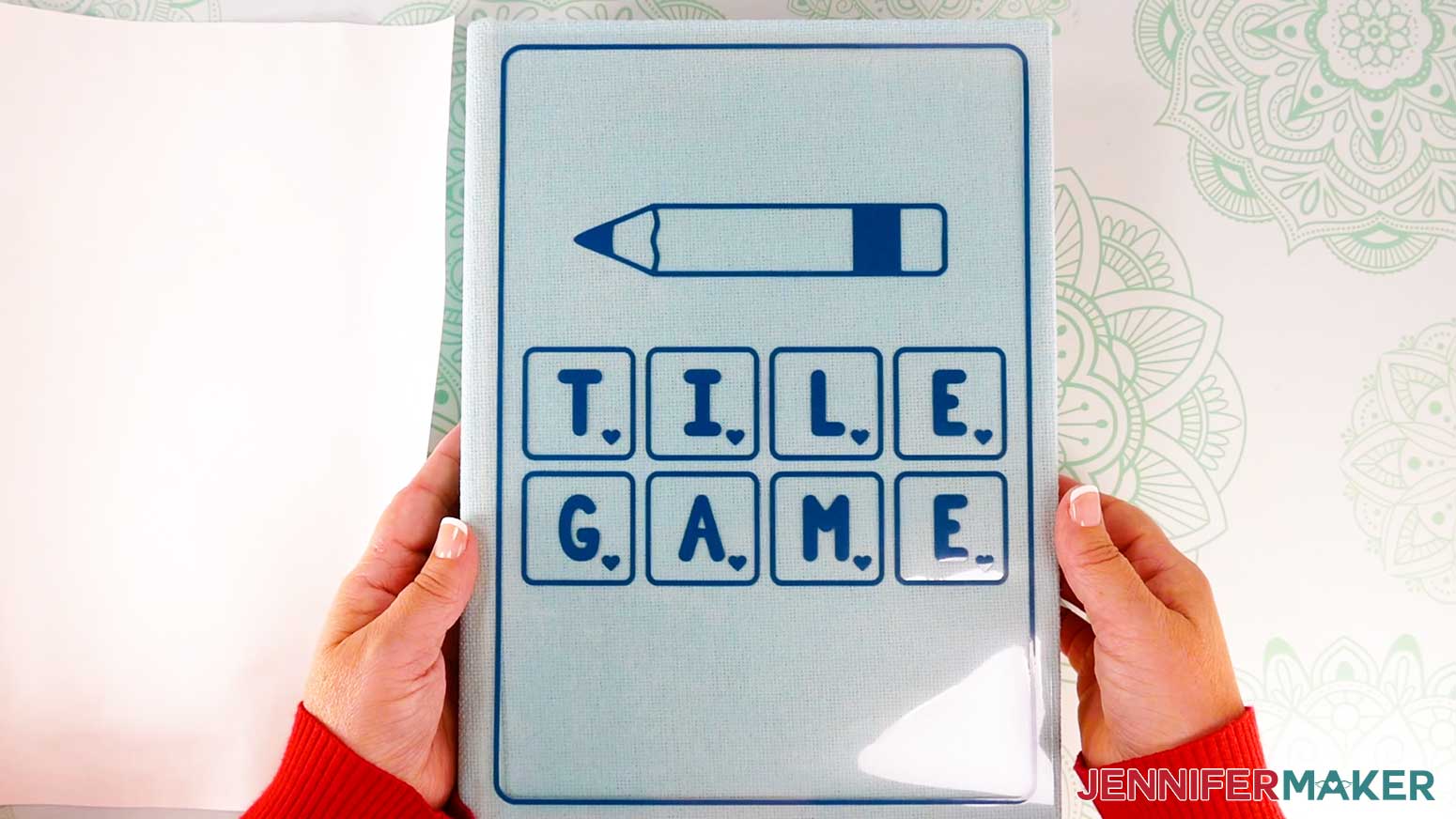 Place the cover decal vinyl side down on the painted board game box&rsquo;s front cover