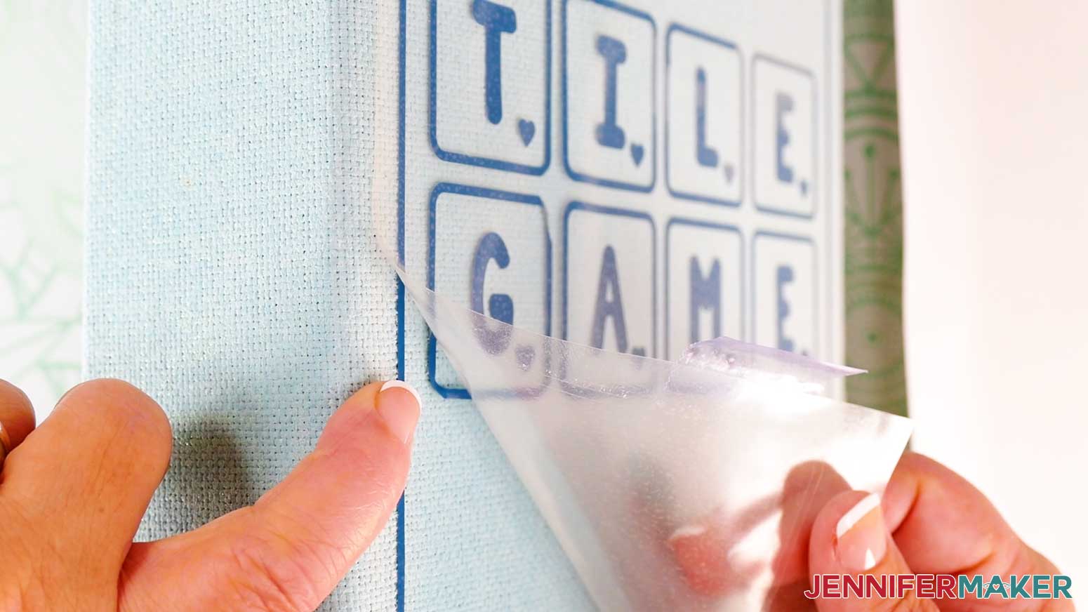 Slowly peel up the vinyl carrier sheet from the DIY board game box