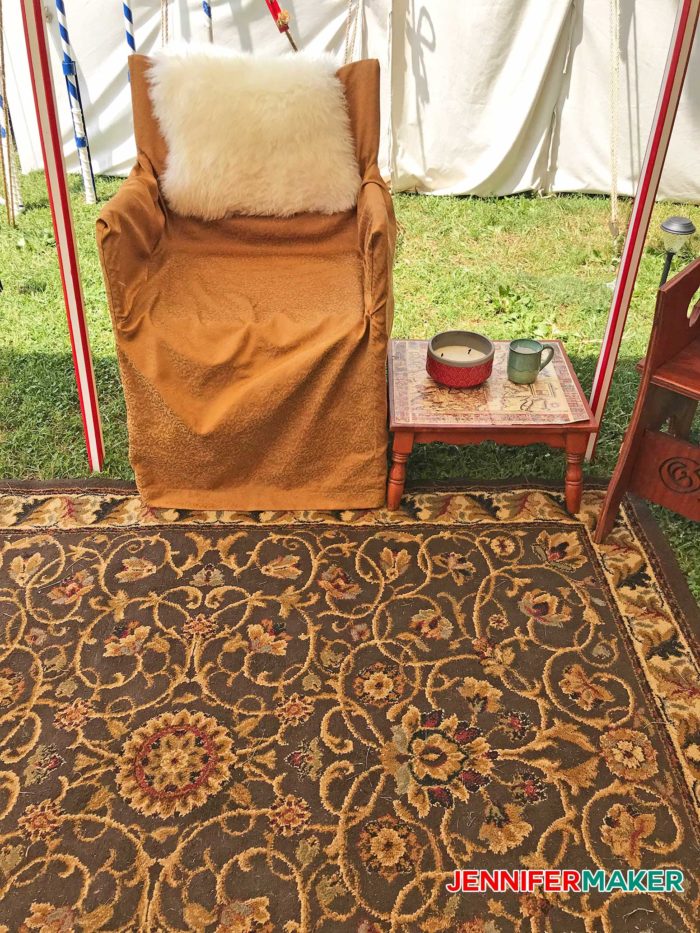 DIY Glamping Chair upholstered in gold with a sheepskin throw