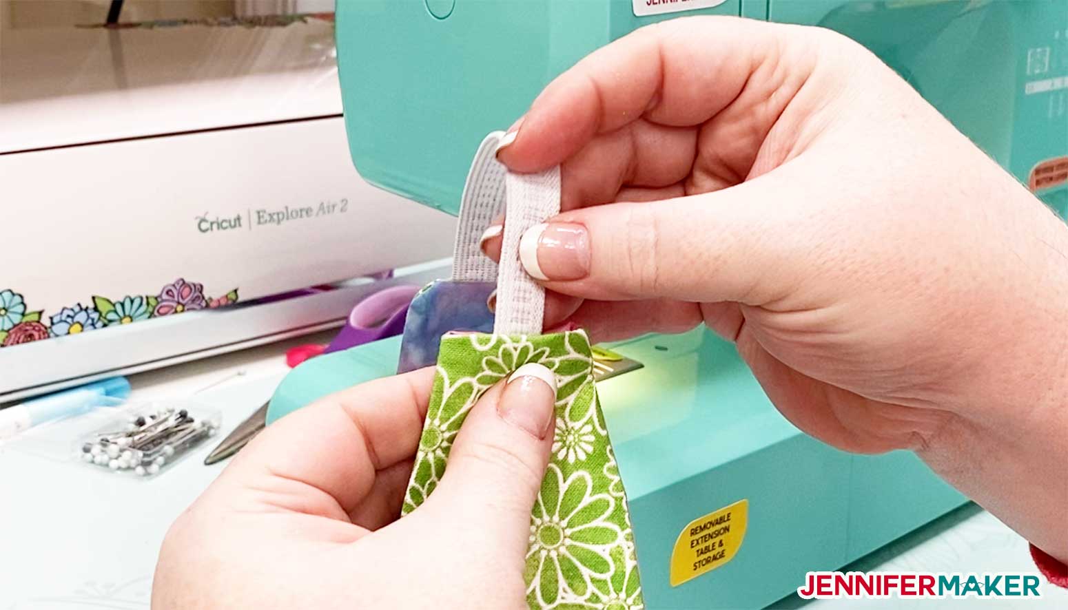 Inserting the other end of the elastic into the unsewn end of your headband with buttons for masks