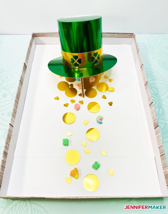 DIY Leprechaun Trap Craft made with a DIY paper hat and gold paper coins and Lucky Charms