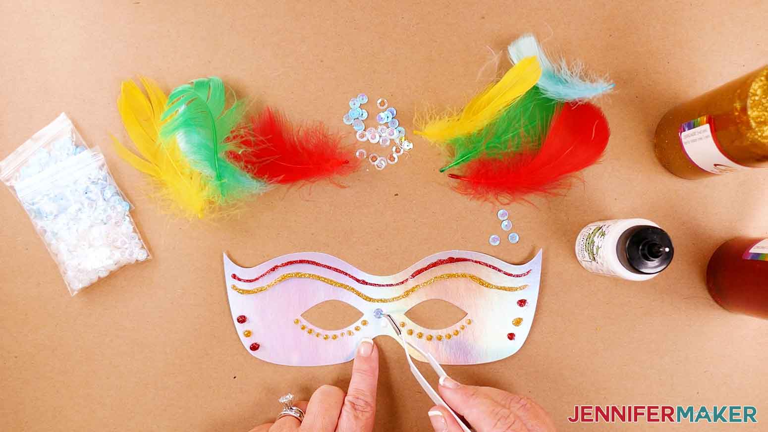 Apply sequins to DIY masquerade mask for personalized design features.