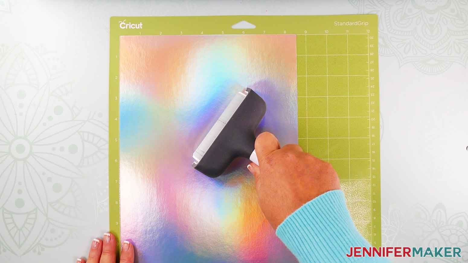 Use brayer to adhere the cardstock to the cutting mat.