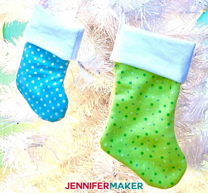 Tiny stocking ornaments, with fabric cut on a Cricut! Make Cricut Christmas Ornaments with JenniferMaker's tutorial!