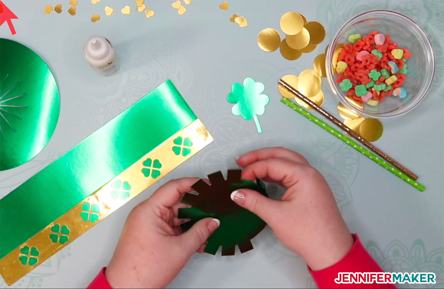 Folding the hat top tabs in for the DIY paper hat and leprechaun trap