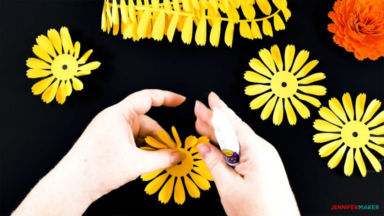 Folding up the base petals of the DIY paper marigold