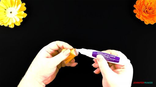 Glue the bottom of the bud petals for the diy paper marigold