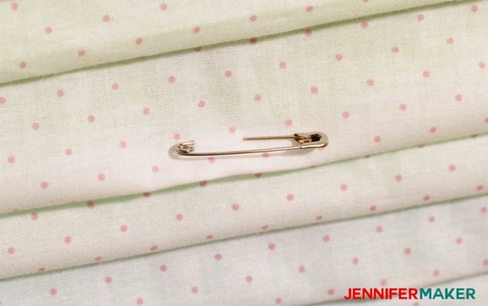A safety pin in the bottom of the paper pockets lets you resize it to fit any size paper