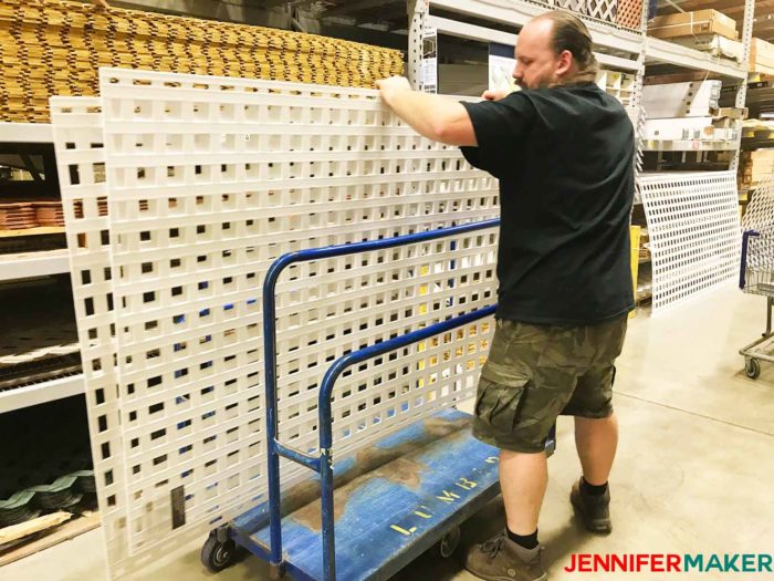 Buying plastic privacy lattice at Lowes to make our DIY pet gate / baby gate