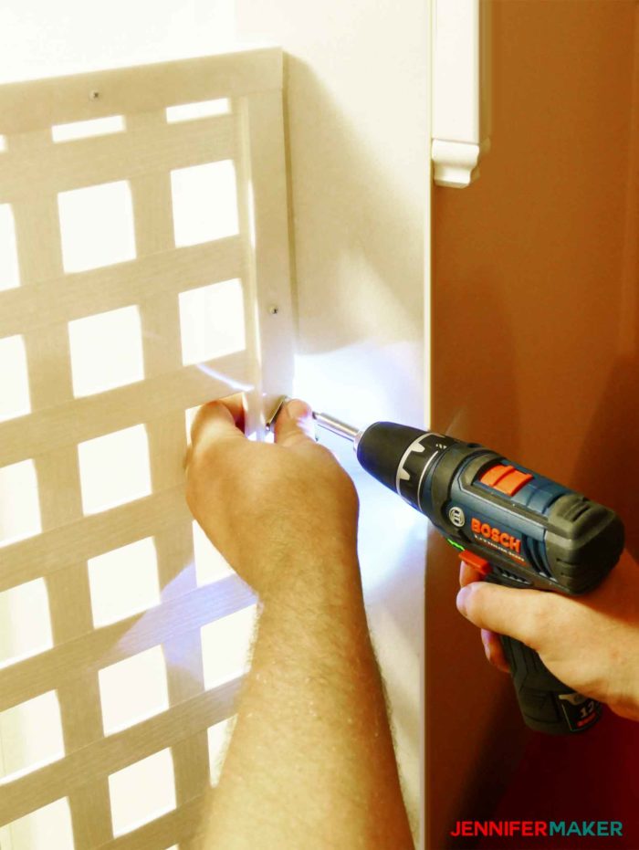 Sliding door latch attached to a wall to secure a DIY pet gate 