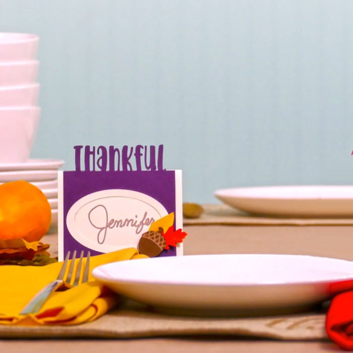 A purple Thankful DIY place card made for Thanksgiving dinner