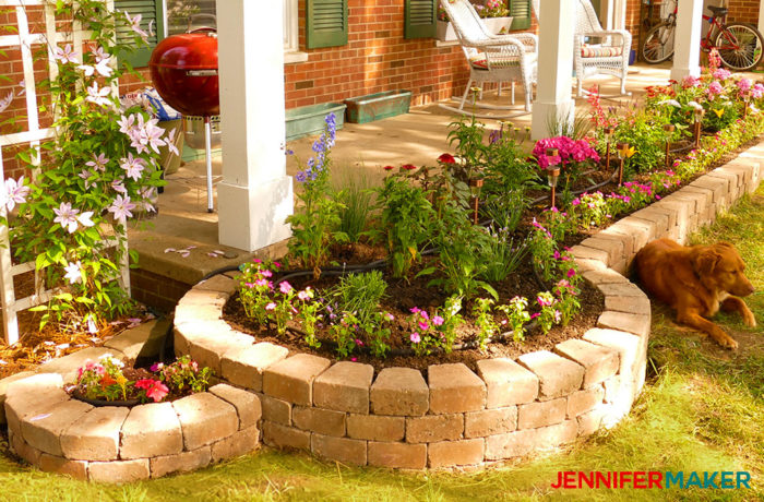 Curved DIY retaining wall with flower bed is easy to make! 