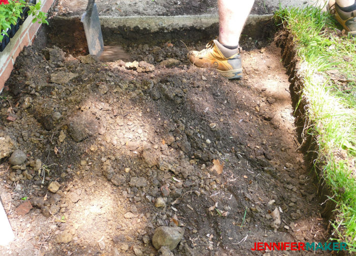 Digging a dirt trench for our DIY retaining wall
