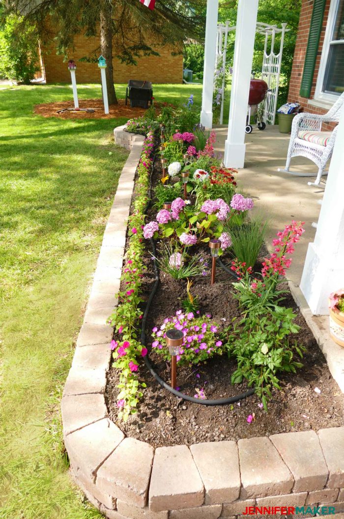 Perennial garden with a tumbled brick retaining wall