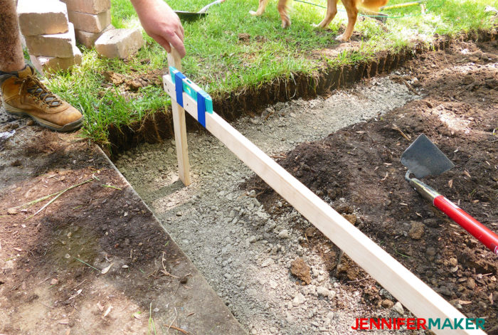 Measuring the depth of a gravel base for a DIY retaining wall