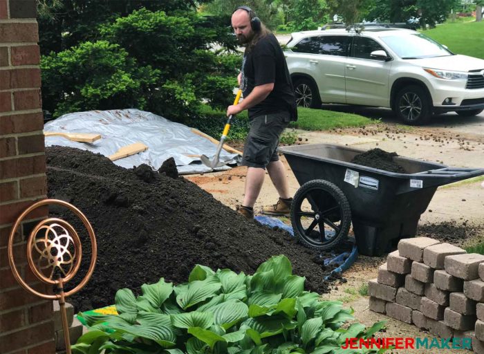 Adding soil to our retaining wall