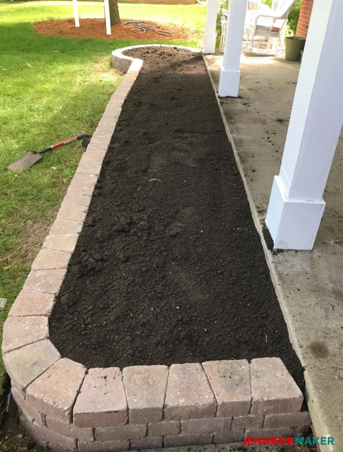 Our garden filled with soil, kept in place with a retaining wall