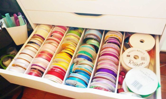 Ribbon spools stored in an Alex drawer with dividers for DIY ribbon storage