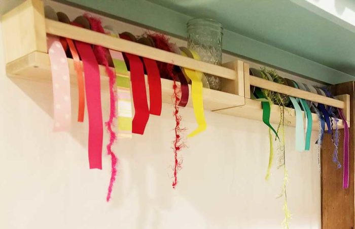 Ribbon stored in IKEA spice racks keeps everything organized