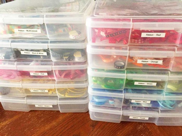 Ribbon organized by color into plastic bins makes great ribbon storage