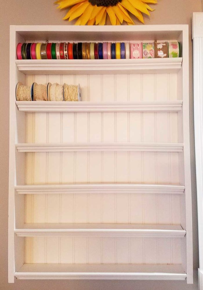 Craft Storage Rack made with beadboard and moulding for DIY ribbon storage and organization